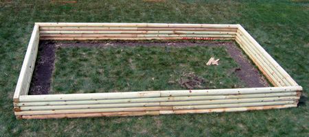 Our raised garden box before 6 loads of dirt and compost.